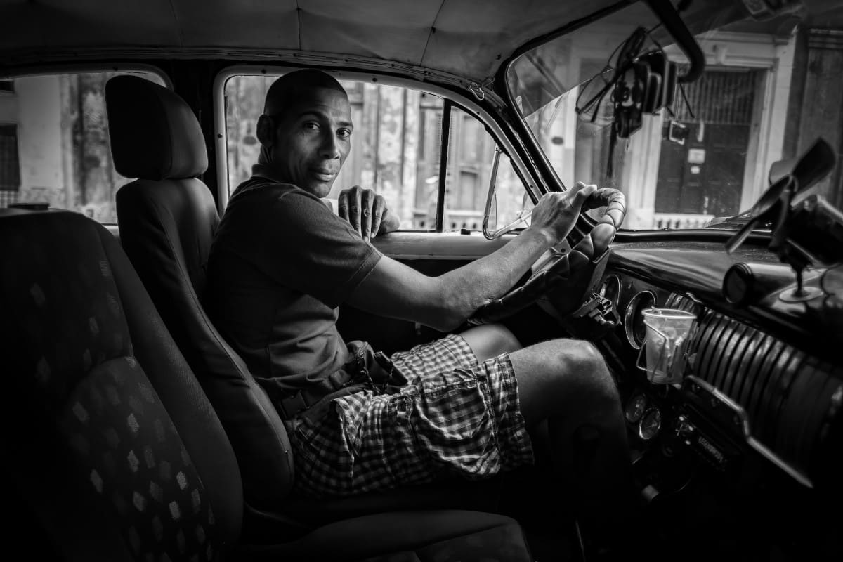 Black and White Portrait of a Cuban Taxi Driver by Michael Chinnici