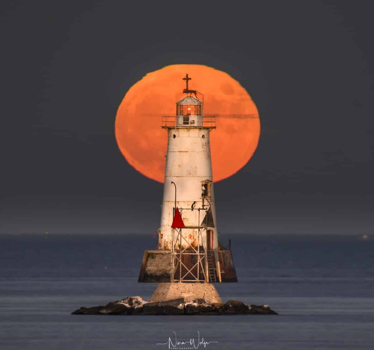 Full Moon Behind a Lighthouse