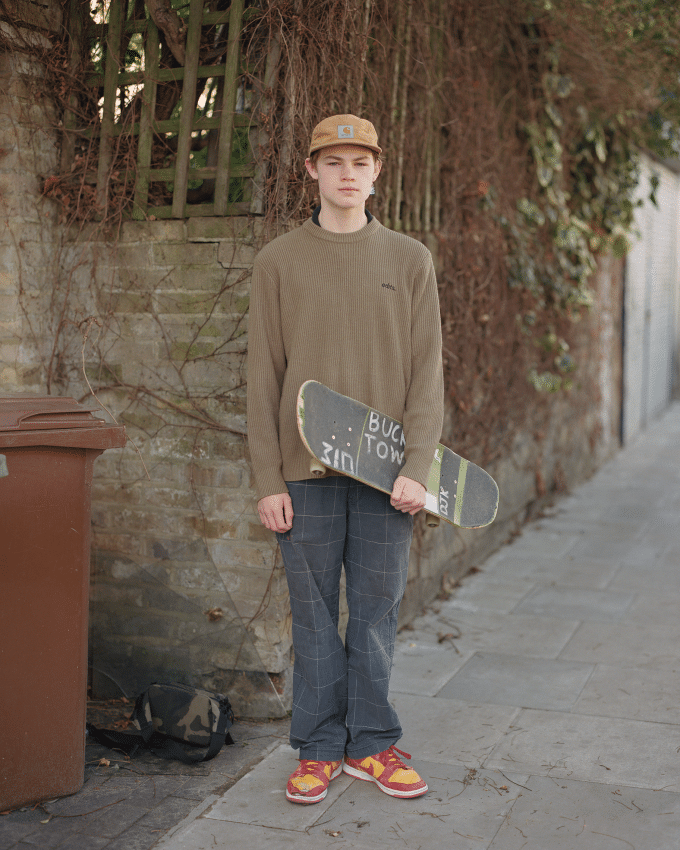 Portrait of a young man with a skateboard