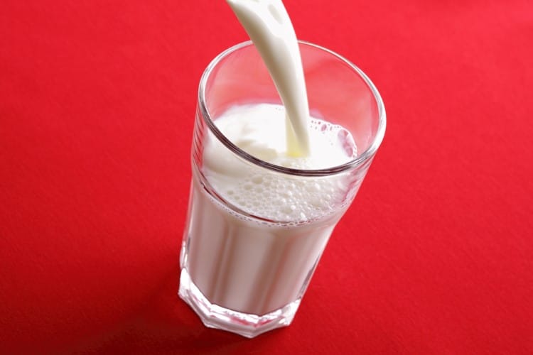 Glass of Milk Being Poured
