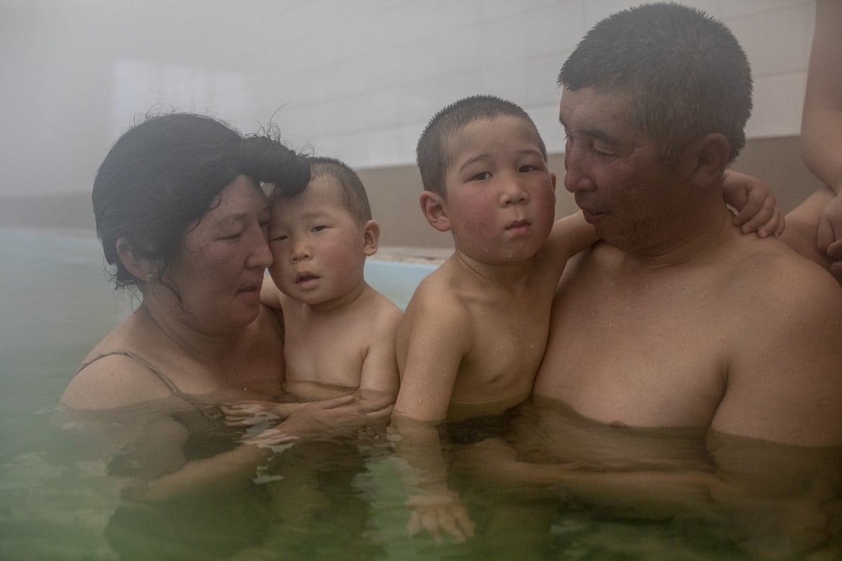 Family Enjoying a hot spring in Kaji-Say, Kyrgyzstan