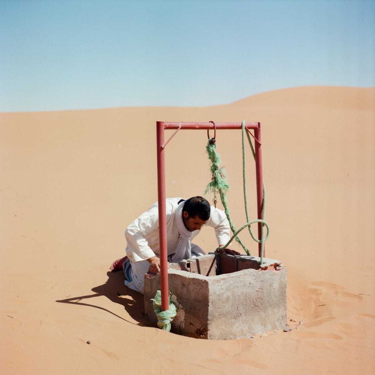 Man Checking Well in Morocco