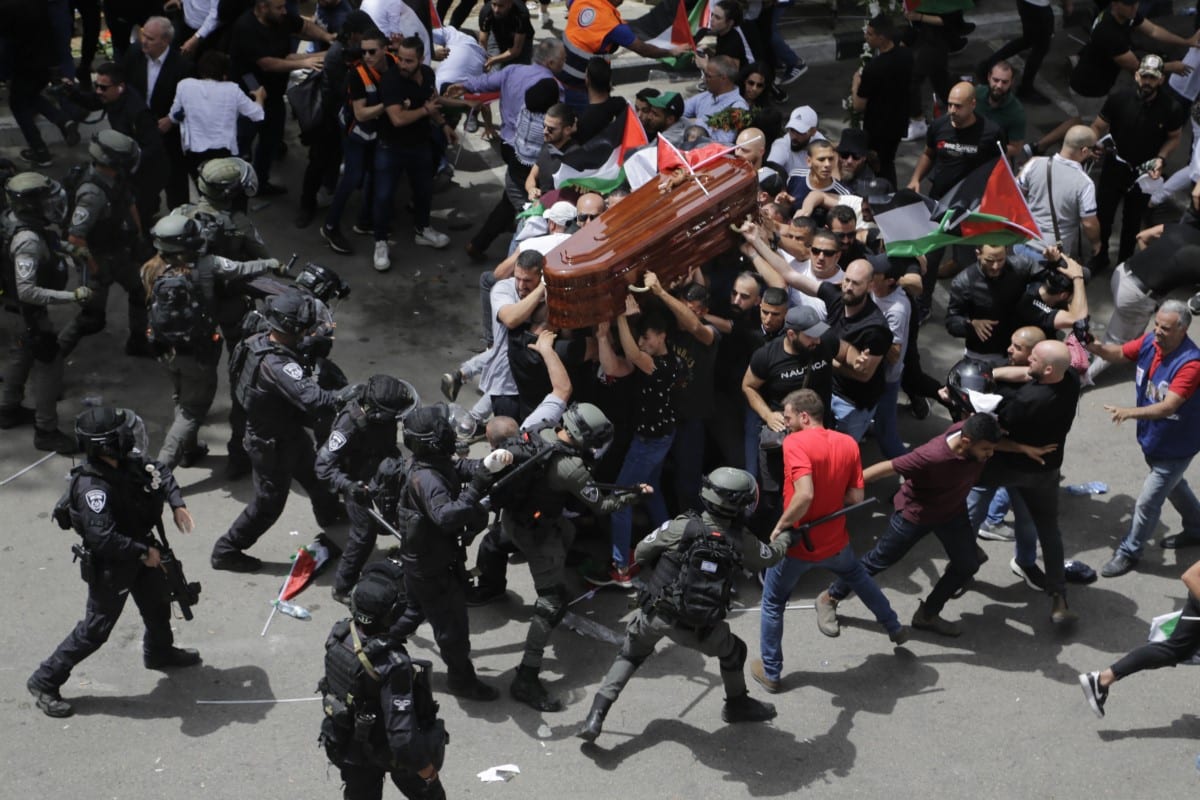 Israeli police beat mourners accompanying the coffin of Al Jazeera journalist Shireen Abu Akleh to her funeral