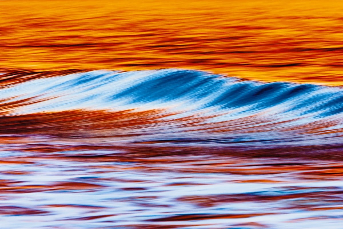 Wave with wildfires reflected in them