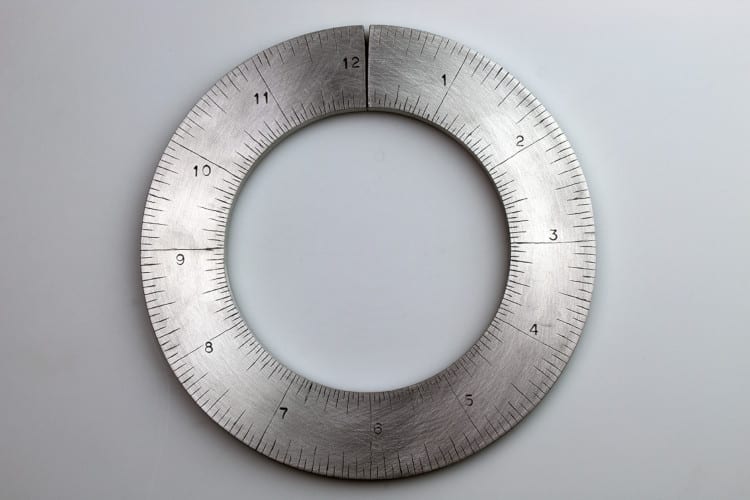 Clock-shaped custom made metal measuring instrument by Rick Salafia