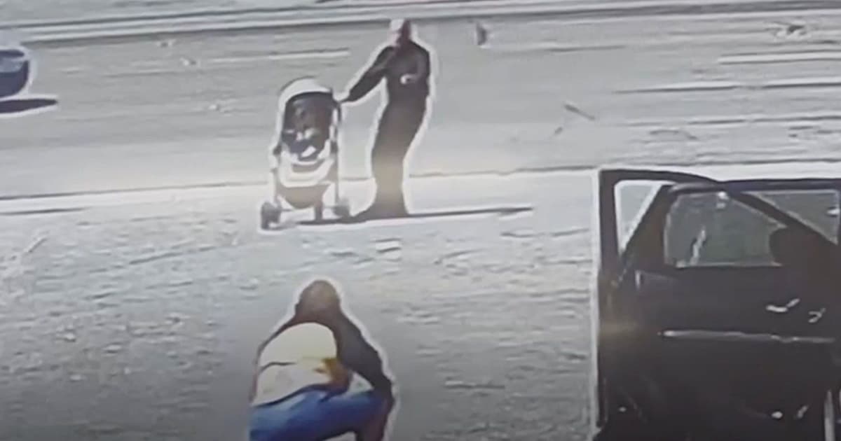 Watch a Man Save a Baby in Stroller From Rolling Into Traffic