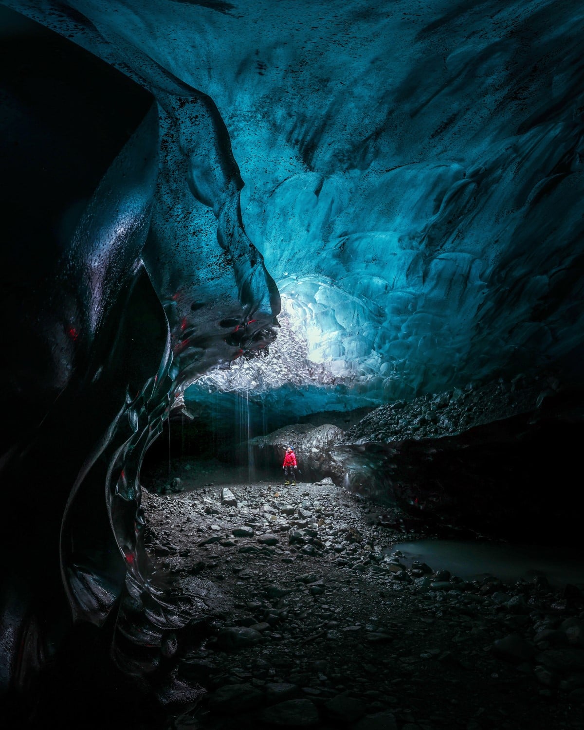 Person Inside an Ice Cave in Iceland