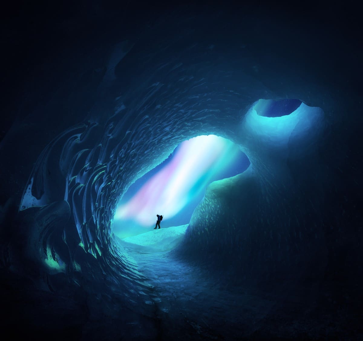 Man in Icelandic Cave with Northern Lights in the Background