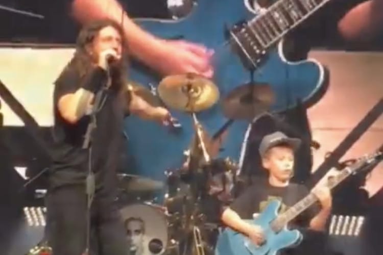 Screenshot of video showing Dave Grohl playing with a 10-year-old fan at a Foo Fighters show