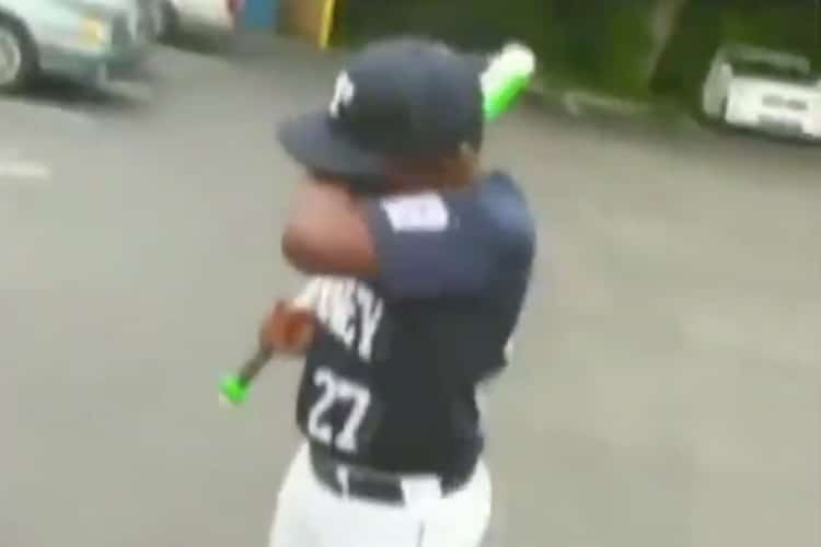 Boy cries tears of joy after getting a green bat