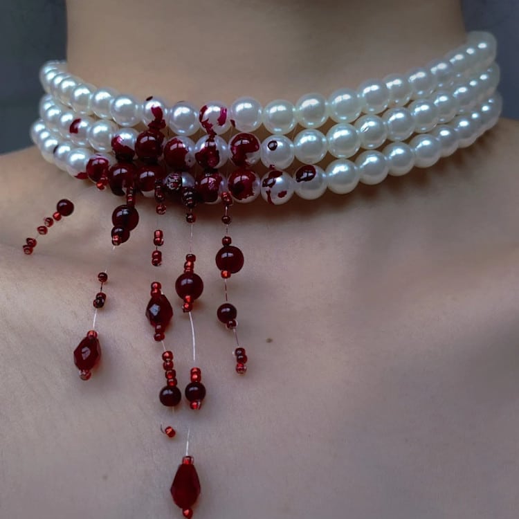 Pearl necklace with fake blood and red beads simulating blood for goth look