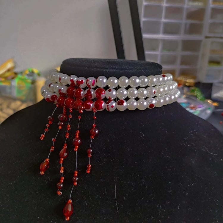 Pearl necklace with fake blood and red beads simulating blood for goth look