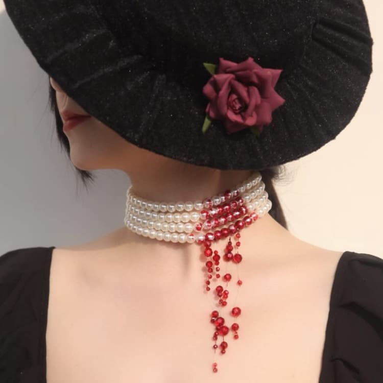 Pearl necklace with fake blood and red beads simulating blood for goth look
