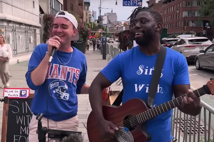One man sings "Tennessee Whiskey" while the other plays guitar