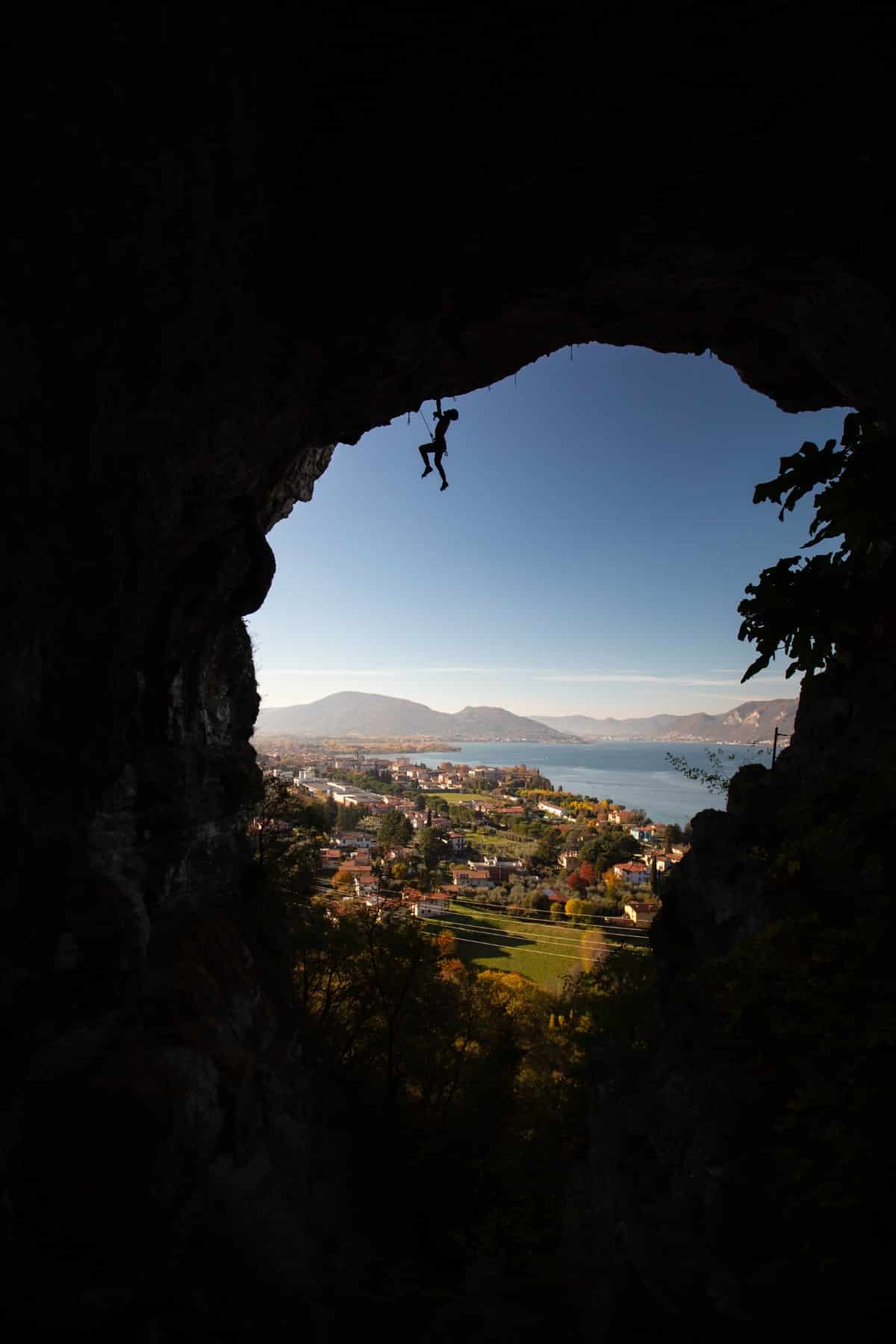 Person Rock Climbing in Silhouette