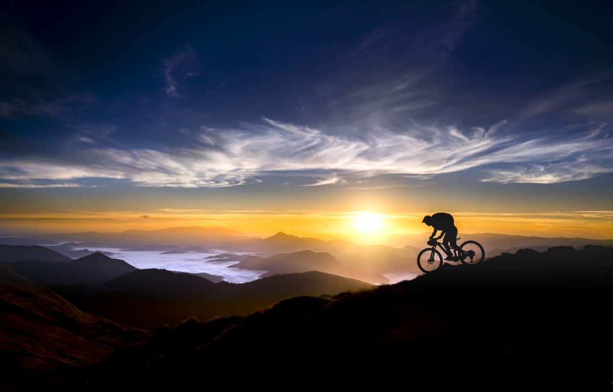 Man Cycling on a Mountain