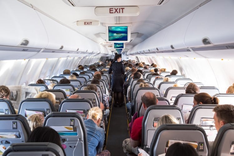 Interior view of passengers in the cabin of a plane