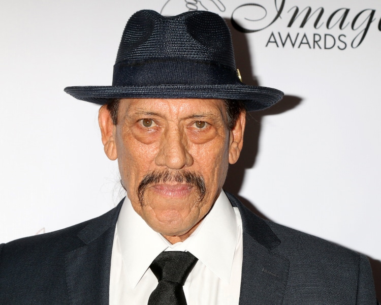 Danny Trejo with a hat