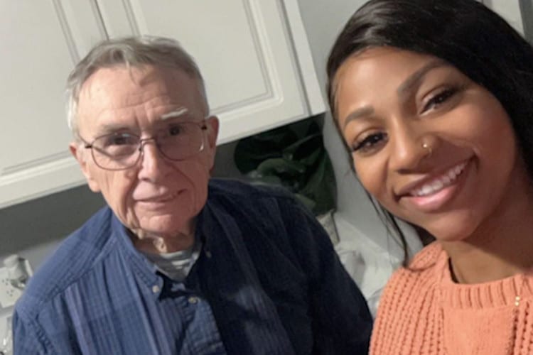 82-year-old Paul Callahan poses with neighbor Sharaine Caraballo who "adopted" him