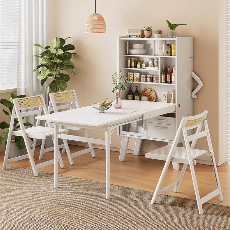 Wooden sideboard that holds a foldout table with chairs