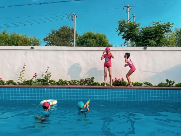 Young girls playing around a pool in Beijing