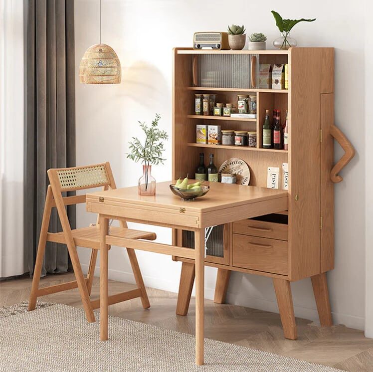 Wooden sideboard that holds a foldout table with chairs