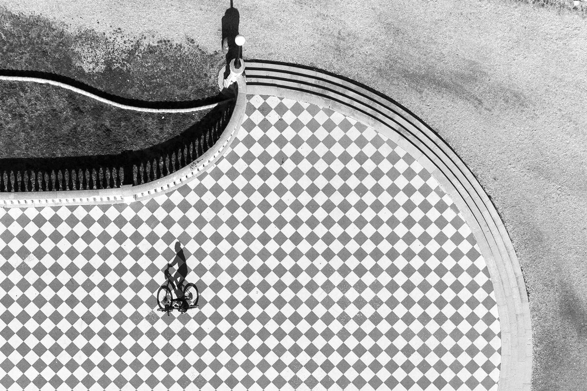 Aerial view of biker in black and white