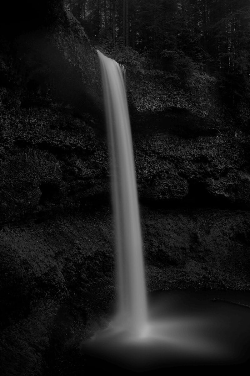 Black and white photos of waterfalls photographed at night