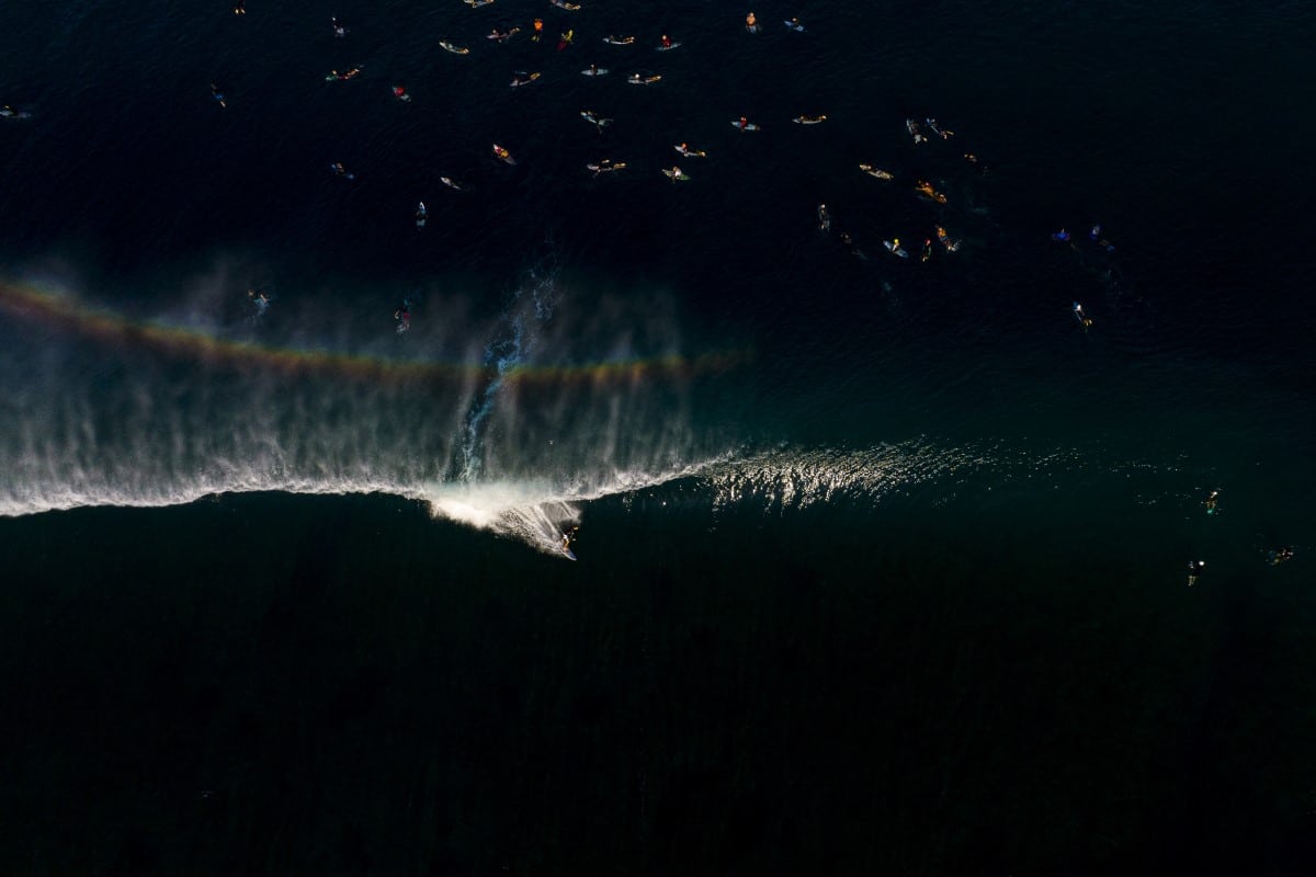 Rainbow appearing while surfing the Banzai Pipeline in Hawaii