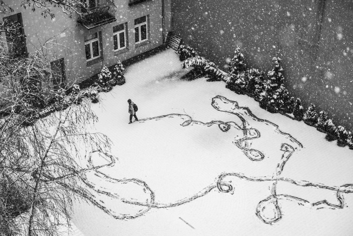 Boy playing in the snow in Krakow