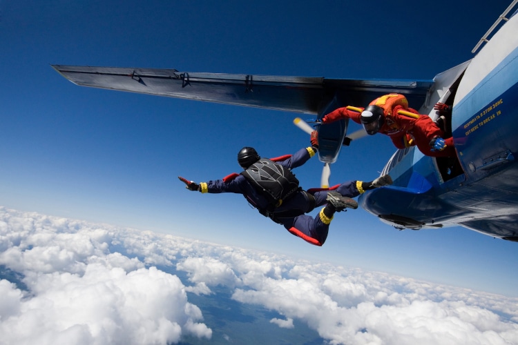 Skydivers jumping from airplane