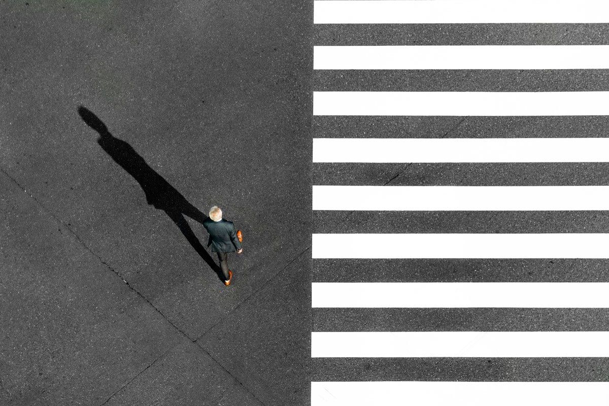 Aerial photo of someone crossing the street in Tokyo