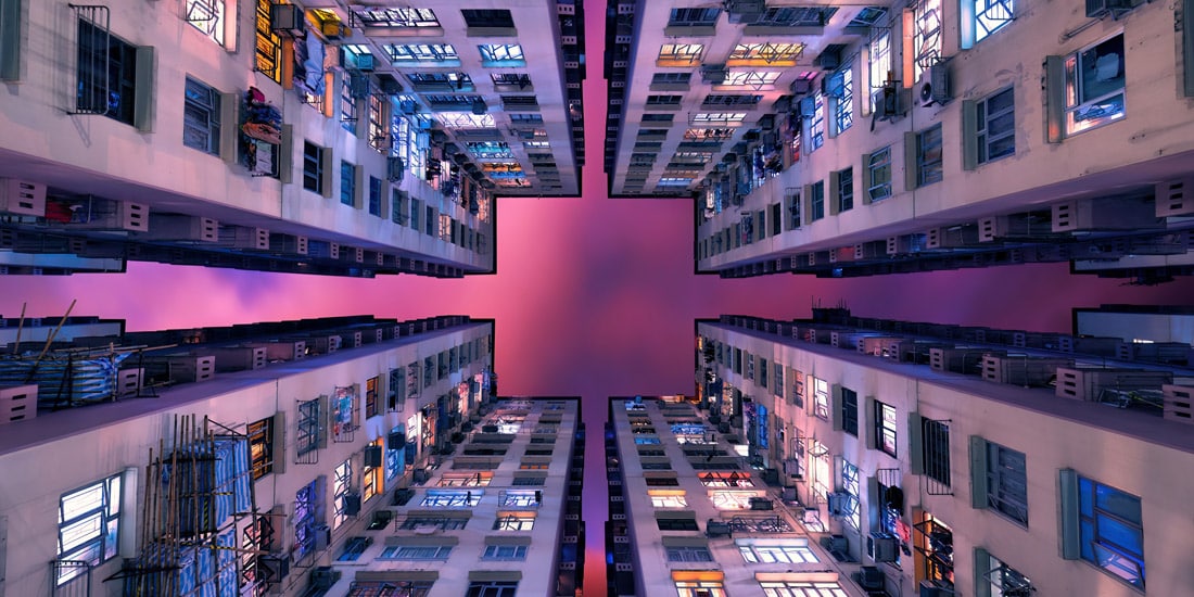 Panorama looking straight up through buildings in Hong Kong