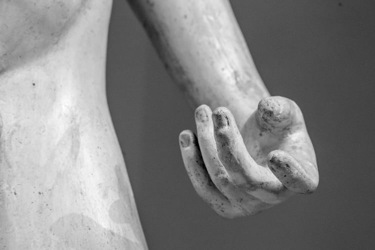 Zoom on hand of marble sculpture