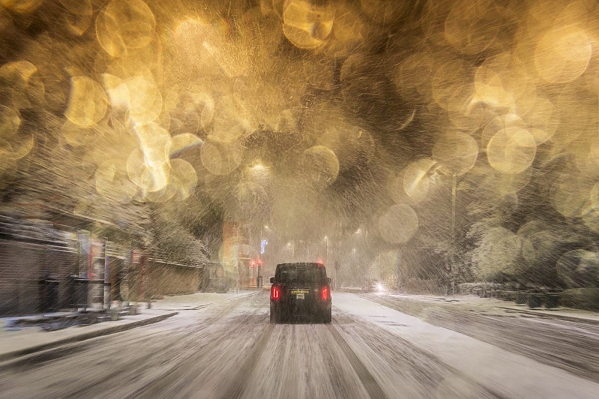 Car driving through the snow