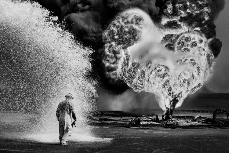 Burning oil wells in Kuwait by Sebastiao Salgado