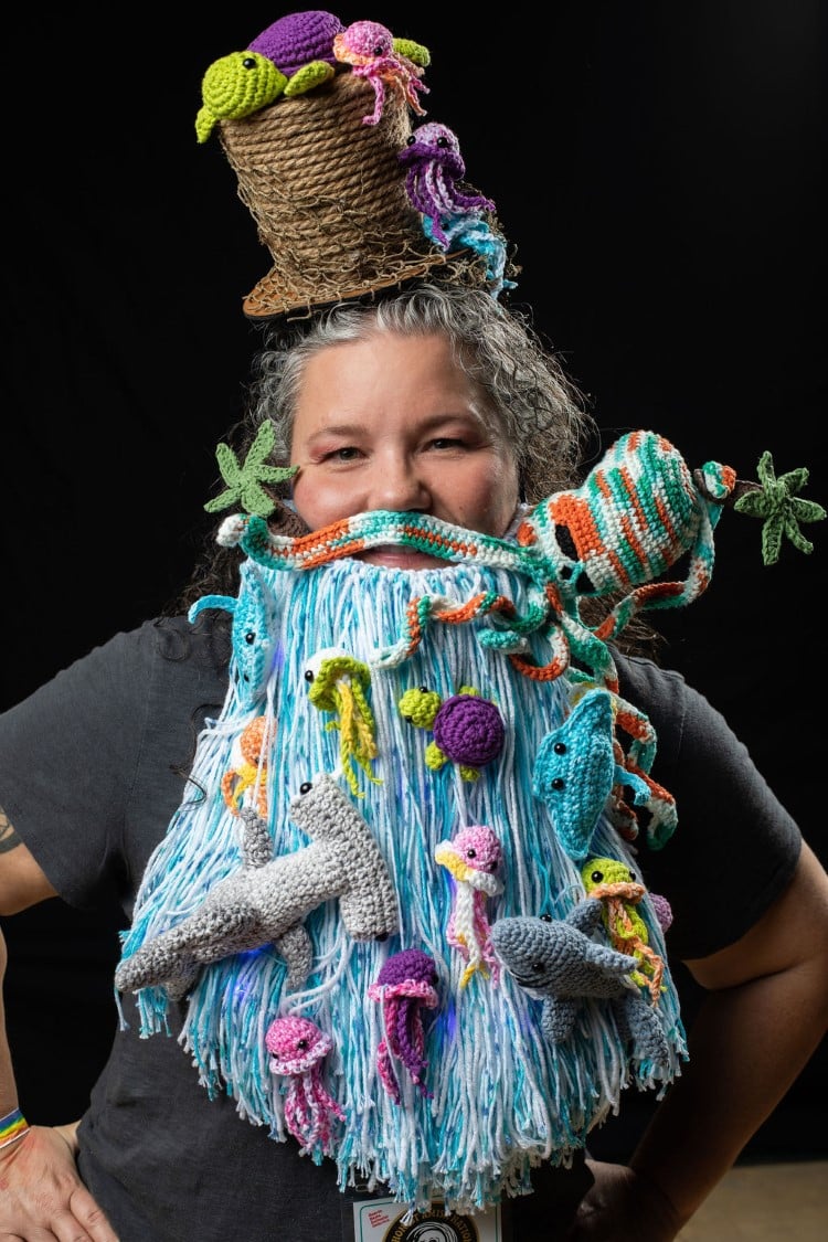 Woman with creative crochet beard