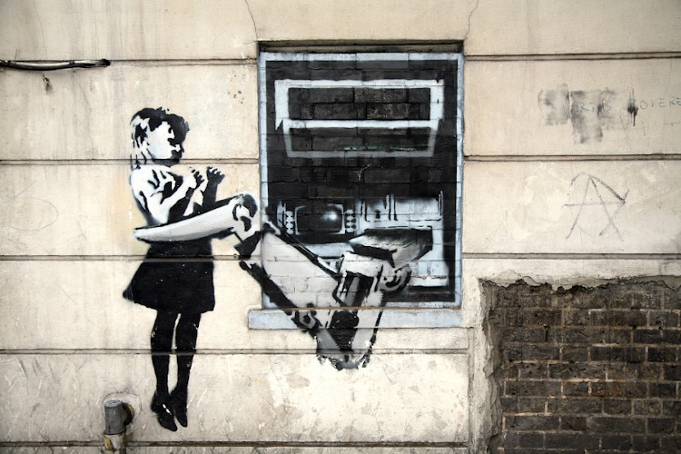 Banksy's "Cash Machine Girl" Graffiti in London.