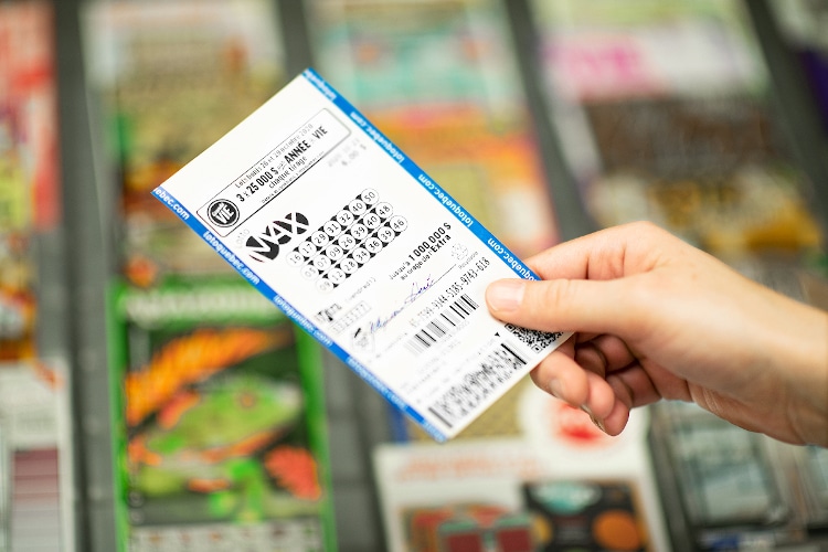 Lottery ticket held by hand