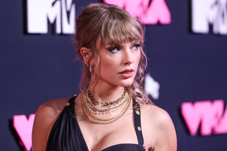 Taylor Swift wearing a Versace dress arrives at the 2023 MTV Video Music Awards held at the Prudential Center on September 12, 2023 in Newark, New Jersey