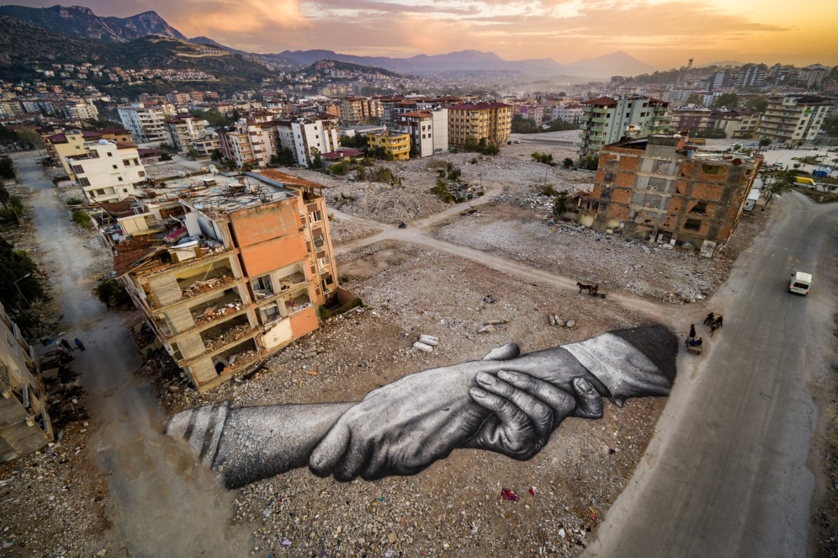 Two hands holding artwork in Hatay, Turkey