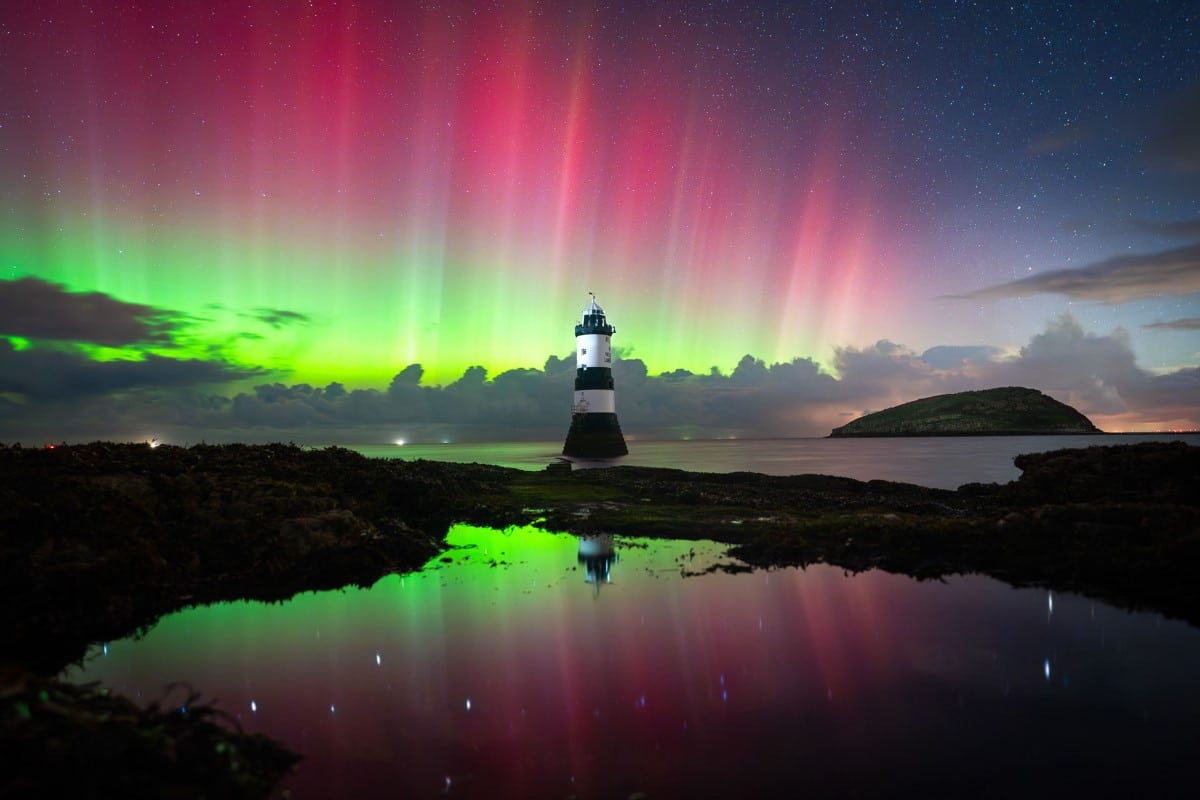 Aurora behind lighthouse in Wales