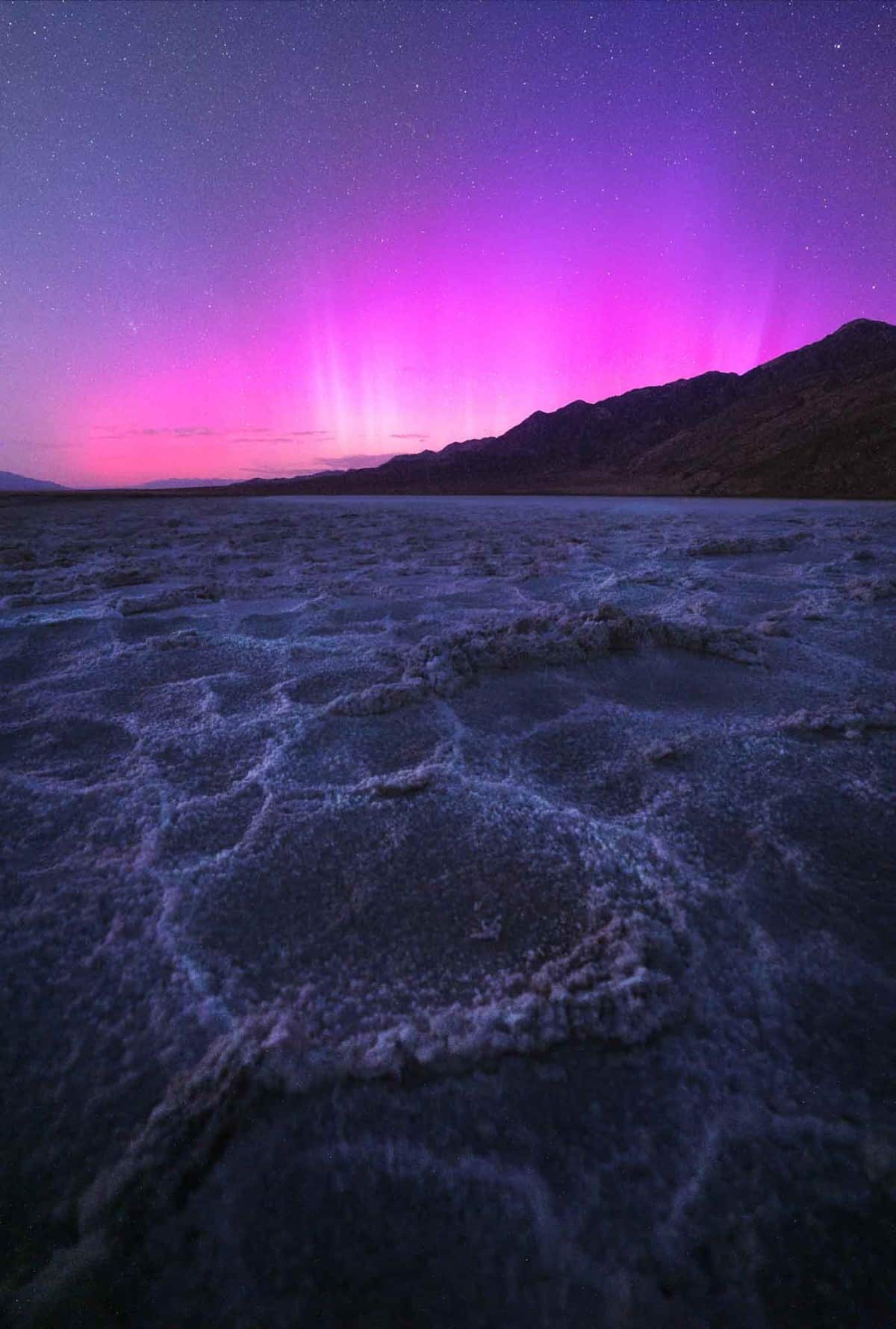 Pink aurora over Badwater Basin in Death Valley