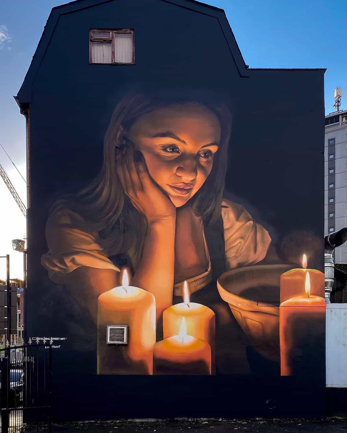 Mural of a Girl With Candles by Elle Koziupa