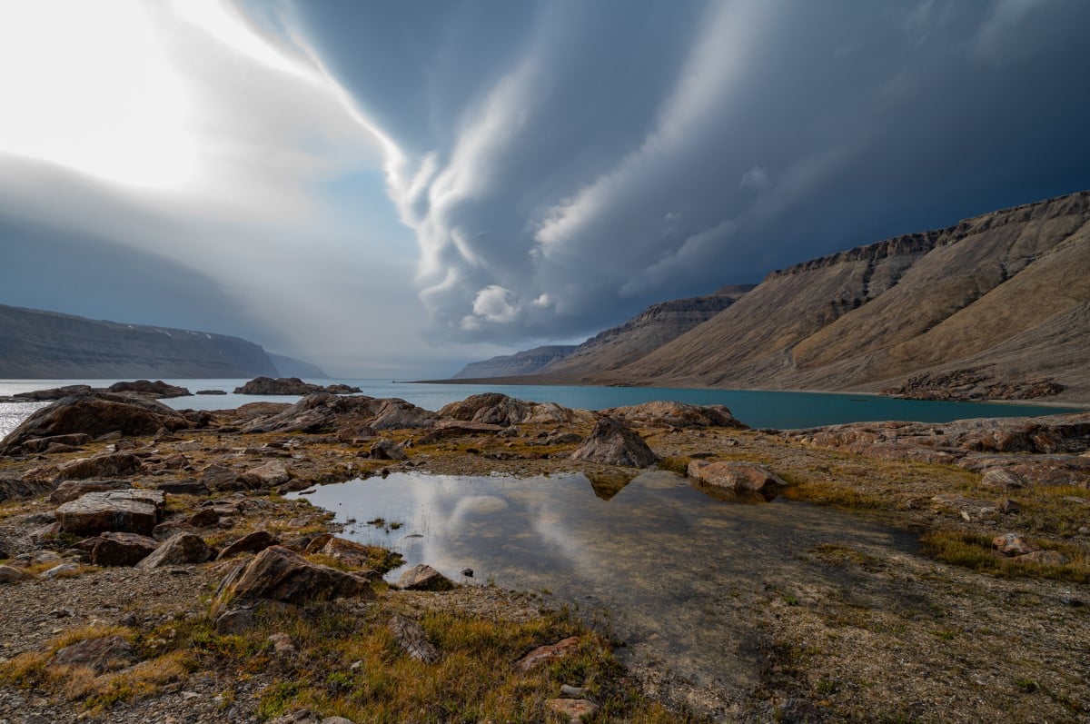 Storm clouds gather over Powell Inlet on Devon Island, Nunavut.