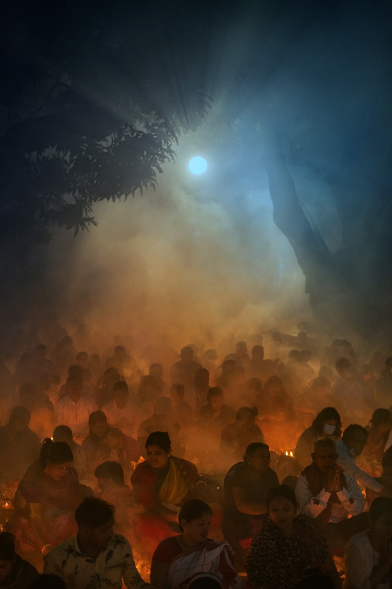 Hindu devotees lit butter lamps and incense during Rakher Upobash festival in Narayanganj, Bangladesh