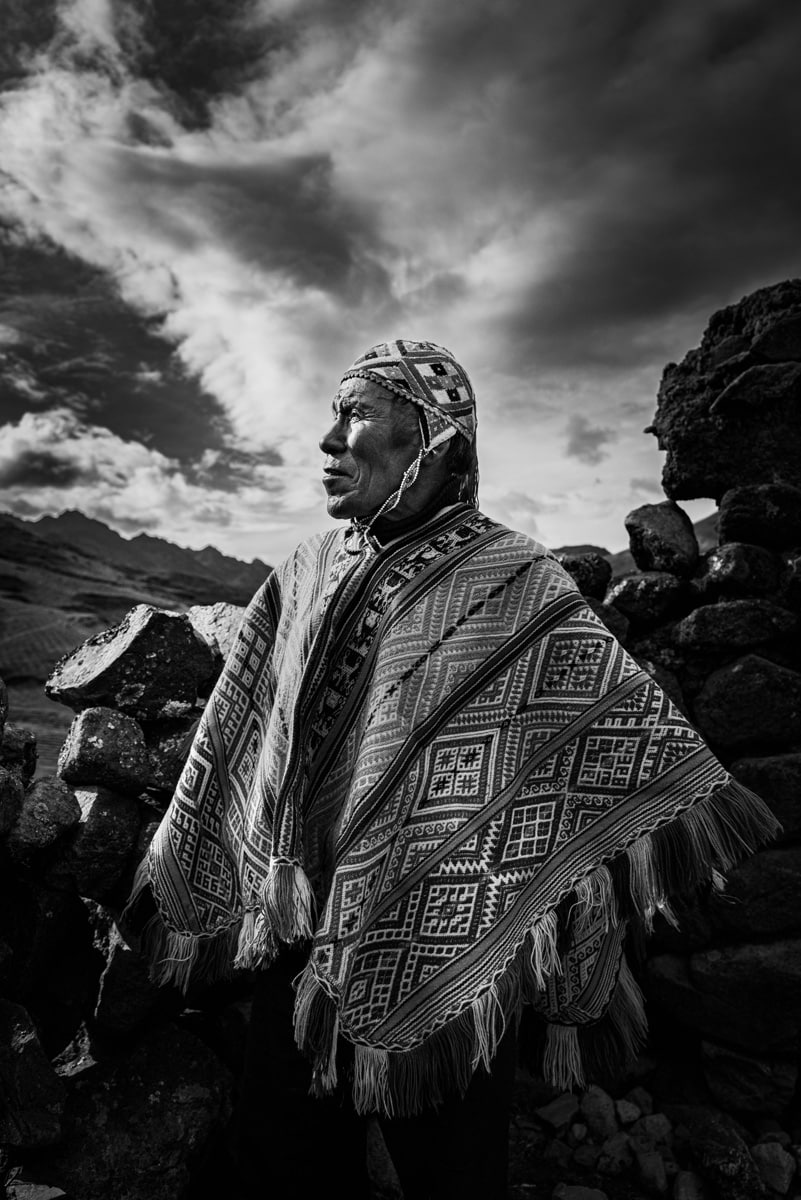 Black and white image of a farmer in Pampallacta, Peru