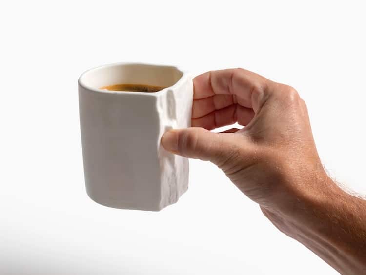 Hand holding a Pinch Hold Mug