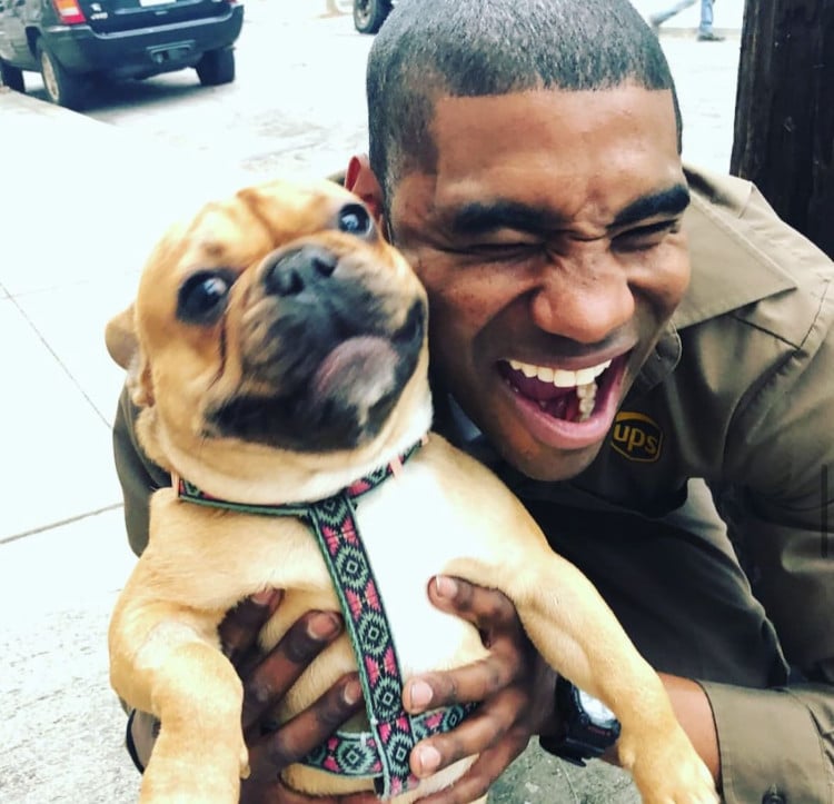 ups driver jason hardesty posing with dogs