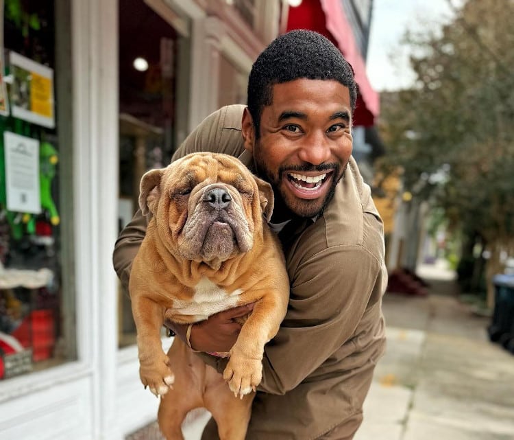 ups driver jason hardesty posing with dogs